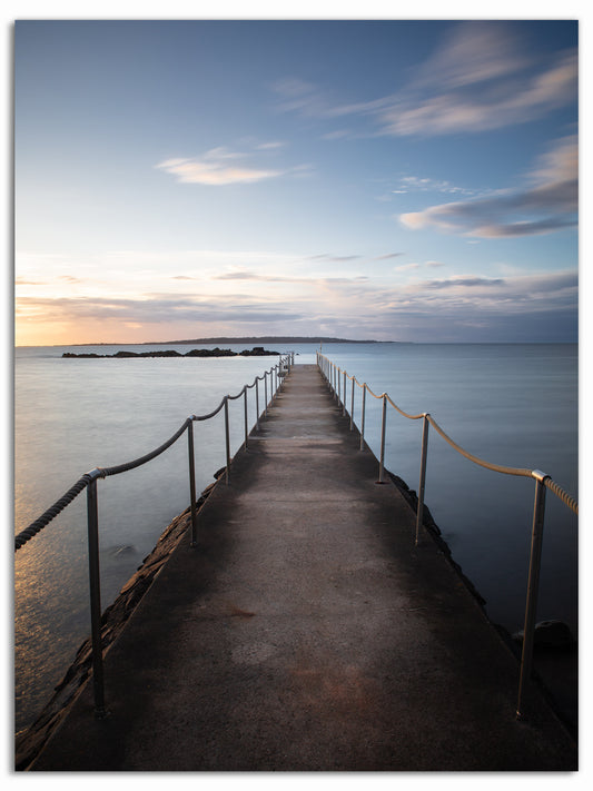 Solnedgång över badbryggan i Torekov