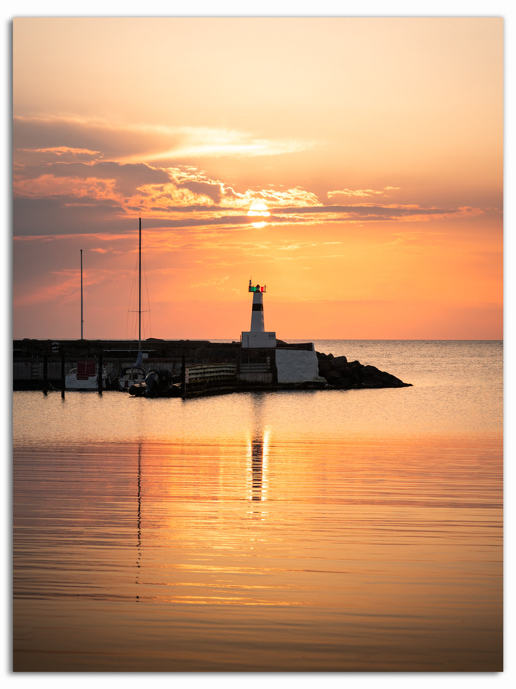 Solnedgång över fyren i Mölle