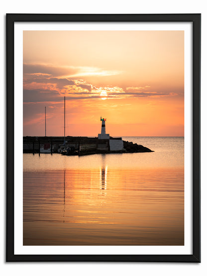 Solnedgång över fyren i Mölle