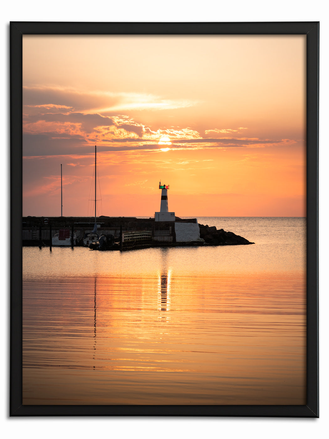 Solnedgång över fyren i Mölle